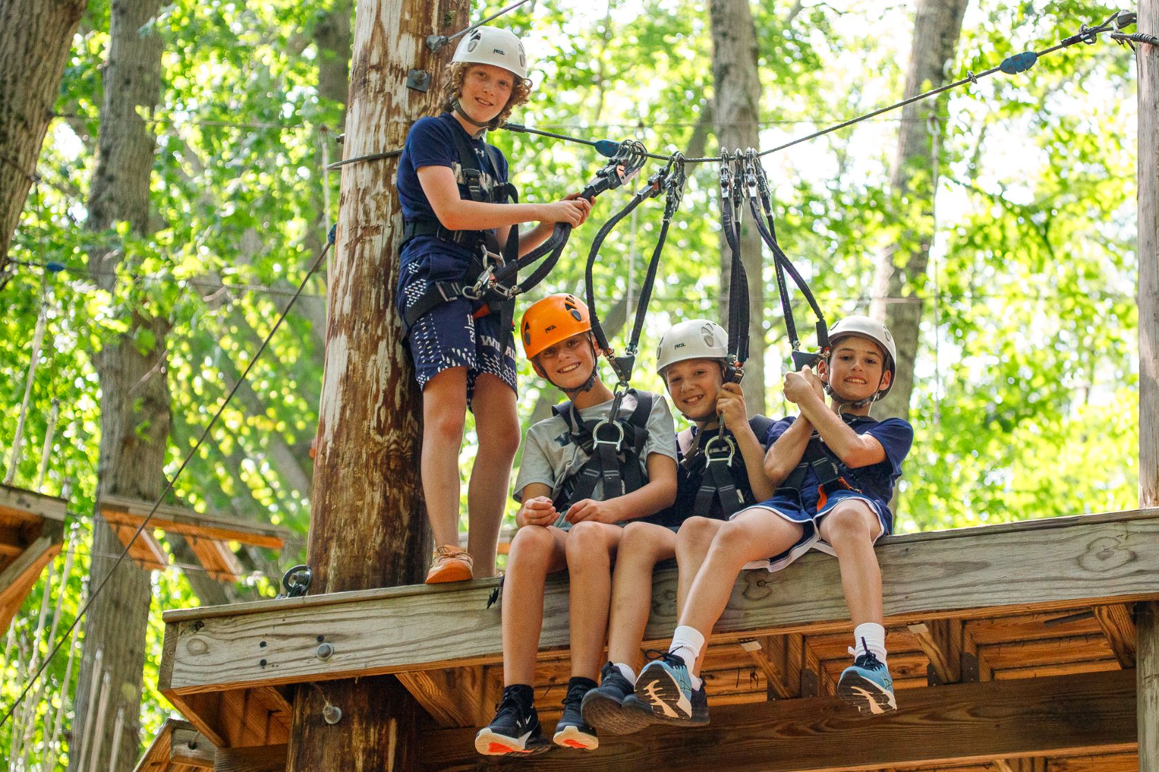 Campers on the high-ropes and zipline course
